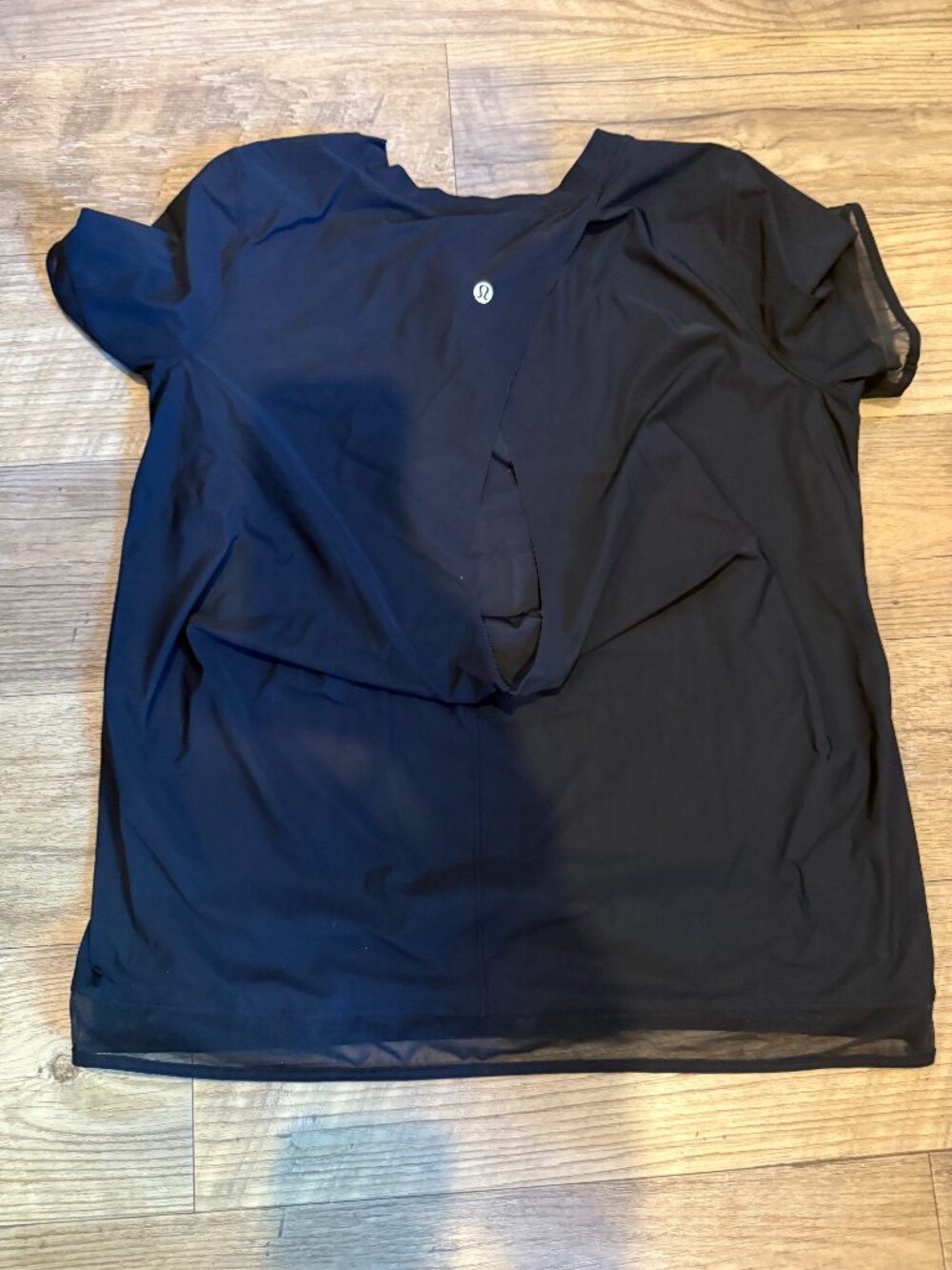 Lululemon Black T-shirt Size 8 (with open peak in the back)